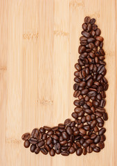 Coffee beans on a wooden background