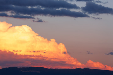 big clouds in the sky before the rain. sunset with the horizon. dark blue sky. image of nature without people