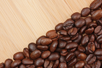 Coffee beans on a wooden background
