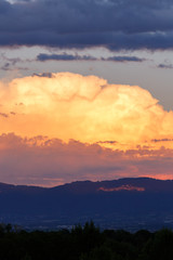 big clouds in the sky before the rain. sunset with the horizon. dark blue sky. image of nature without people