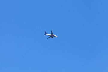 Passenger jet plane flies in sky