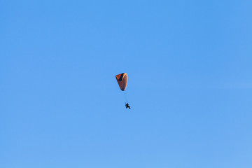 Paraglider in blue sky, ultralight aircraft