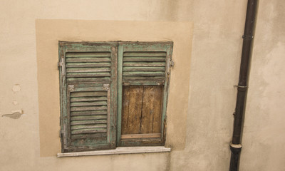 Typical ancient window of a medieval village in Tuscany