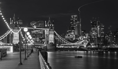 Fototapeta na wymiar London - The Tower Bride, promenade and skyscrapers at dusk.
