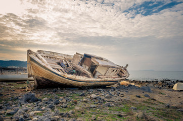 Shipwreck at the coastline of a small cretan fishing village. Once upon the time it was sailing to...