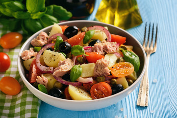 Potato salad with tuna, olives, capers, tomatoes and red onion.