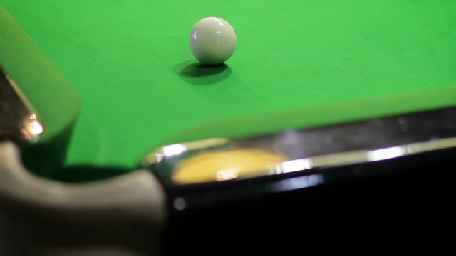 Fall of a red ball into a corner pocket on a snooker table