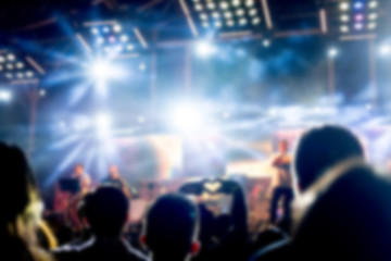 Blurred background : Bokeh lighting in outdoor concert with cheering audience