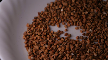 Buckwheat falls on a white plate