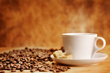 coffee cup with sugar and coffee beans