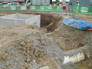 Underground piping work in progress at the construction site. Trenches was build to place the underground pipe. 