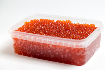 red caviar salmon in a jar on a white background