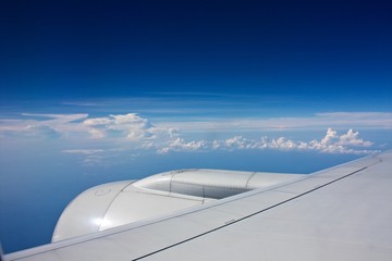 Fototapeta na wymiar above the clouds view from the plane window beautiful sky scenery 2