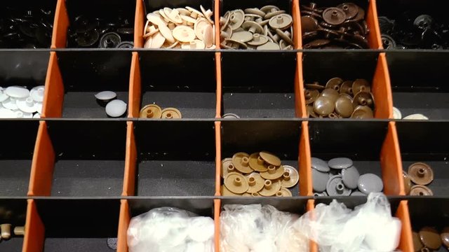 The video shows plastic plugs for furniture accessories