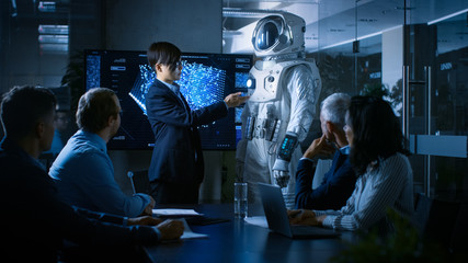 In the Conference Room Chief Engineer Presents Next Generation Space Suit to a Board of Directors. Completely Original Design with Integrated AI and Neural Network Systems. New Level of Space Travel. © Gorodenkoff