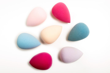 Closeup photo of colorful beauty blenders on a white background