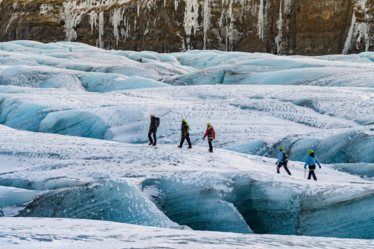 mountaineers hiking a glacier