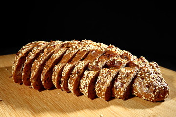 freshly baked multigrain bread on rustic background, top view