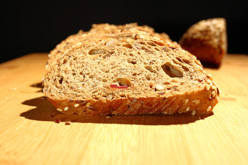 freshly baked multigrain bread on rustic background, top view