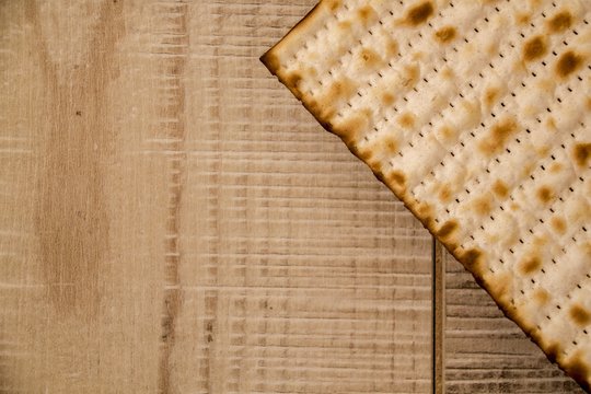 Jewish traditional  Passover Matzot on rustic wooden background.Top View