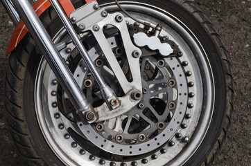 Detail of front wheel of motorcycle.