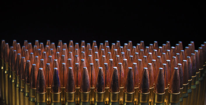 AR-10 ammo in 338 on a black background