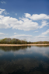 Fototapeta na wymiar Summer holiday in Poland. Cloudy blue sky over the lake.