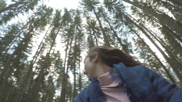 Point of view of excited teen woman running away and screaming playing in mountain forest 