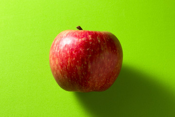 Apple on a green background