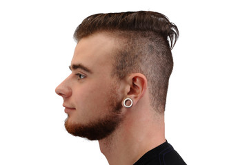 Obraz premium Collage of a handsome young man, with a beard and tunnels in his ears, isolated on white