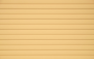 Fototapeta premium Background from horizontal beige siding panels, protected wooden building from bad weather conditions front view