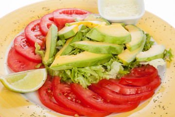 delicious salad avocado, tomato and lettuce
