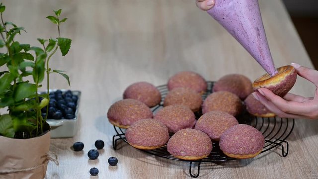 Cream puffs with cracelin filling blueberry cream