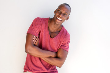 Obraz premium handsome african man smiling by white background