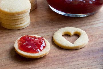 Preparation of Linzer Christmas cookies - filling with jam