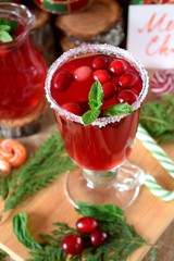 Hot cranberry tea in an Irish mug decorated with sugar border and mint