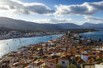 View of the Chora village of Poros island and Galatas village in Peloponnese from a nearby hill,...