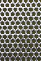 Shiny metal surface with holes