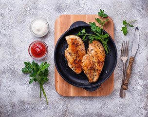 Grilled chicken breast or fillet on iron pan © Yulia Furman