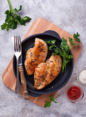Grilled chicken breast or fillet on iron pan