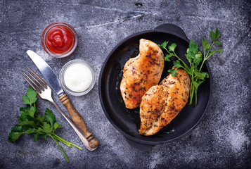 Grilled chicken breast or fillet on iron pan
