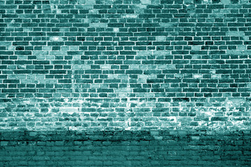 Weathered brick wall background in cyan tone.