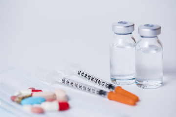 Two Insulin syringes with two ampules and some medicines