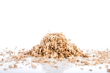 Oak wood shavings on white background, shadows and reflections, wood waste, space for text