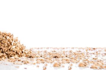 Oak wood shavings on white background, shadows and reflections, wood waste, space for text - obrazy, fototapety, plakaty