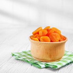Delicious dried apricots and raisins in the bowl. Square. The concept is healthy food, vegetarianism, diet, vitamins.