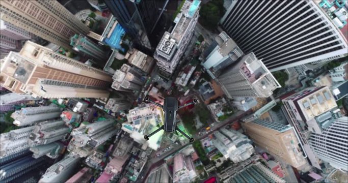AERIAL. Animation of drone quad copter with high resolution digital camera flying over the Hong Kong city