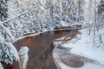 Red cliffs and river Amata at Cesis. 2013