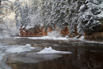 Red cliffs and river Amata at Cesis. 2013
