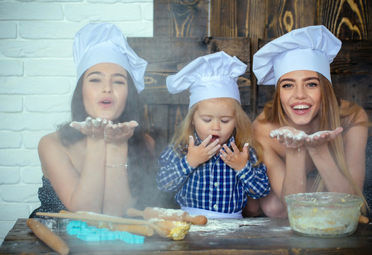 Child and women blowing flour